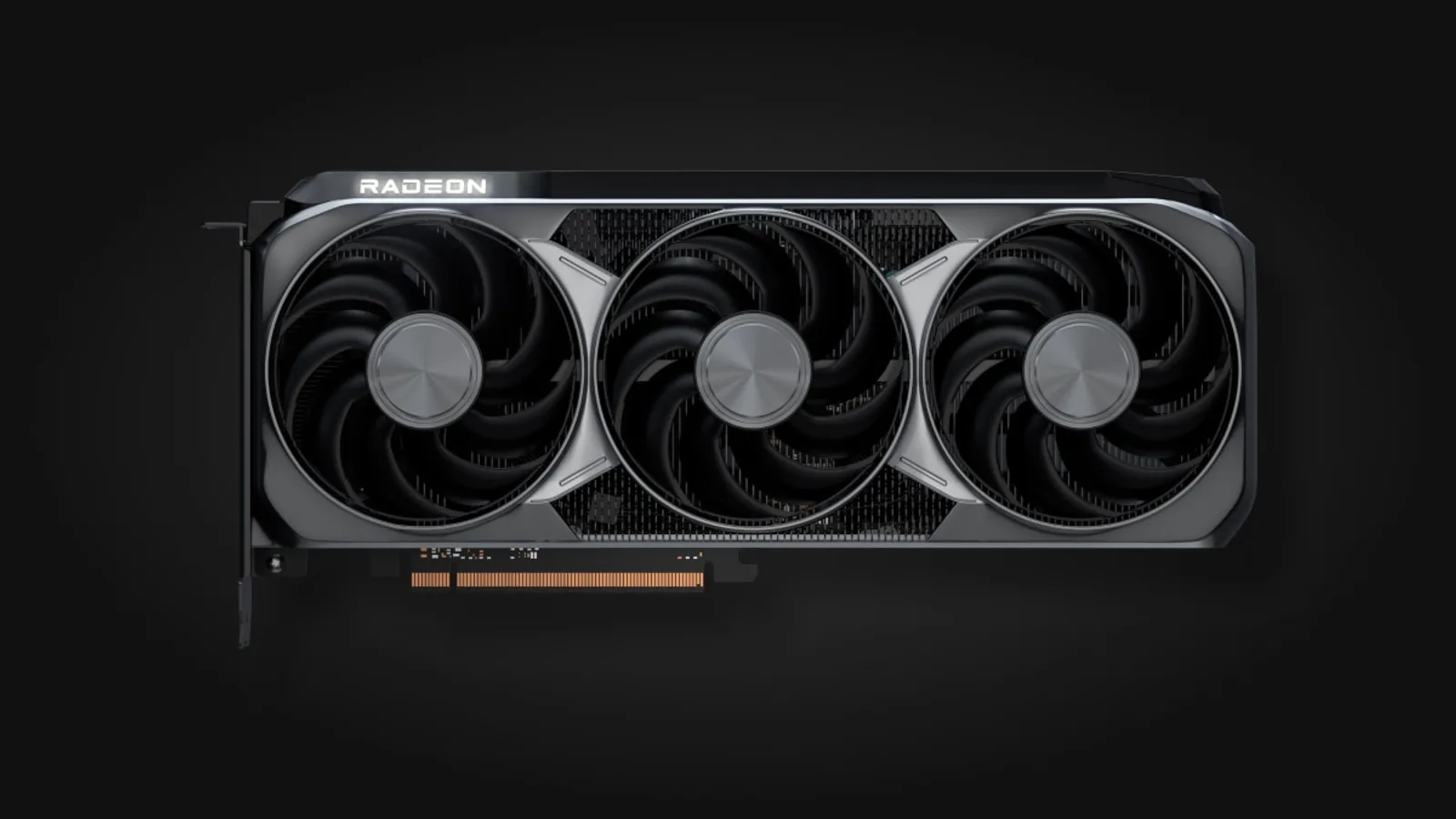 AMD 라데온 RX 9070 XT 그래픽카드 제품 사진 - 검은색 트리플팬 쿨러를 장착한 그래픽카드가 어두운 배경 위에 정면으로 놓인 모습