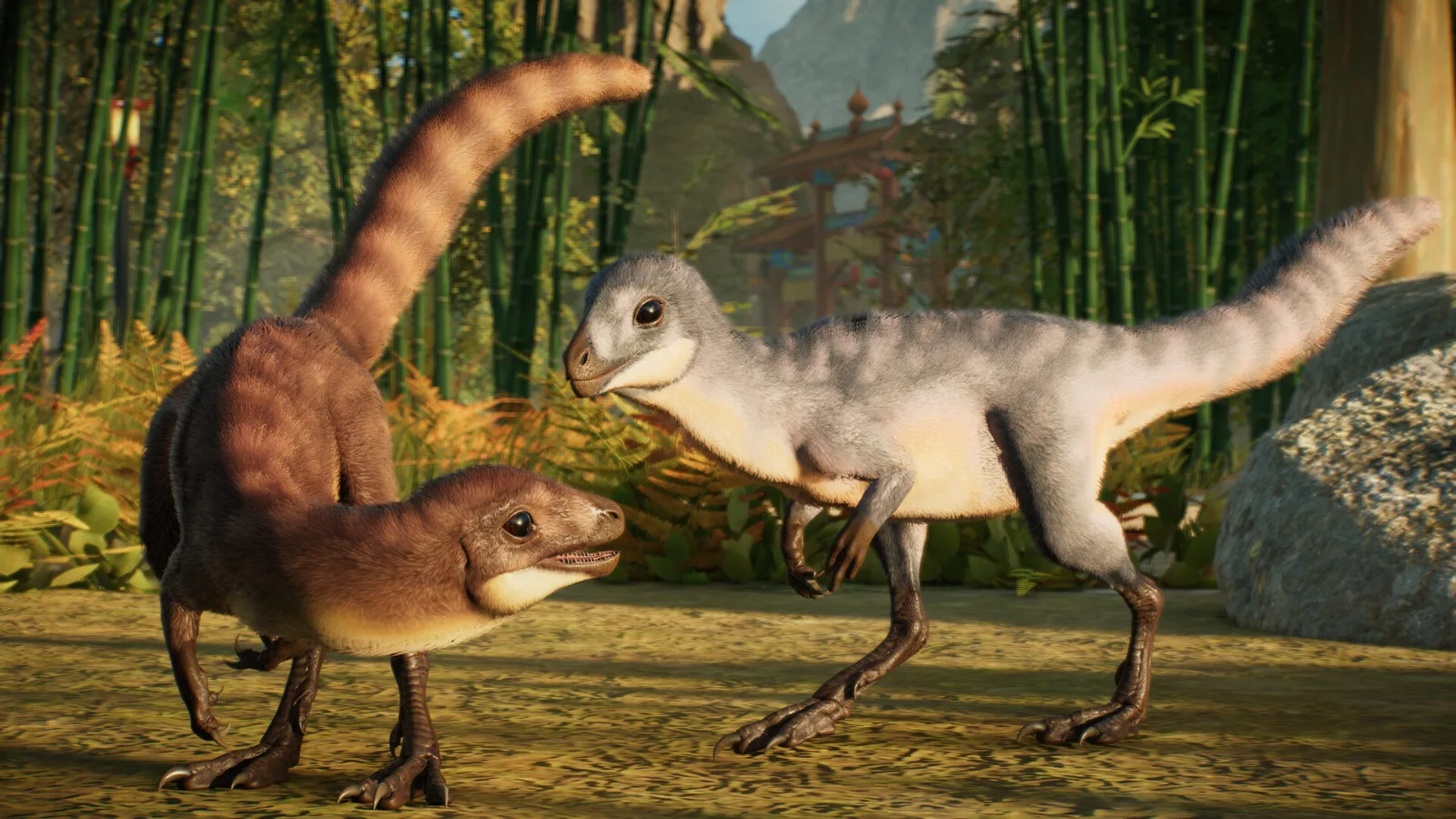 대나무 숲에서 털이 난 새끼 공룡 두 마리가 서로 마주 보고 있는 쥬라기 월드 에볼루션 3 Prehistoric East DLC 스크린샷