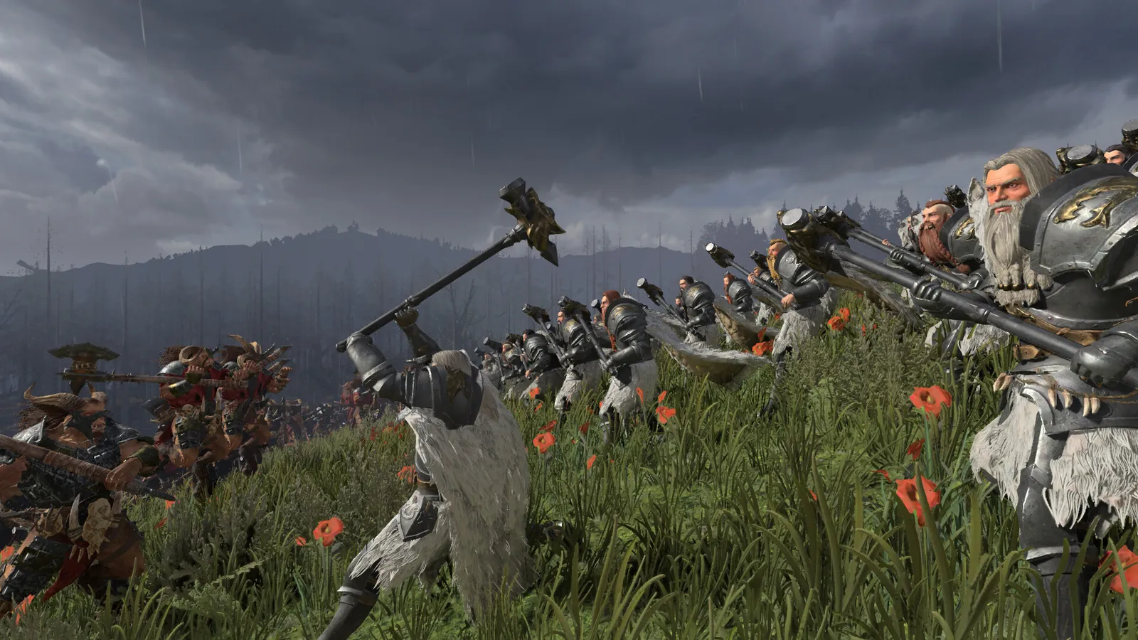 토탈 워 워해머 3 보리스 DLC 화면 - 흐린 하늘 아래 풀밭 언덕에서 모피 두른 중장갑 병사들이 망치를 치켜들고 카오스 전사들과 맞서는 장면